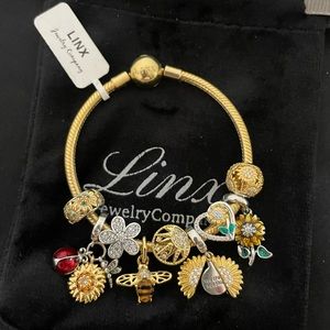 Linx Yellow Gold Bracelet with Gold and Silver Sunflower Themed Charms
